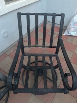 Two beautiful black swivel metal chairs