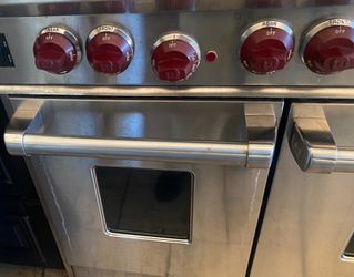Wolf Stainless Steel Range with Red Knobs