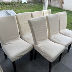 Seven dining room chairs