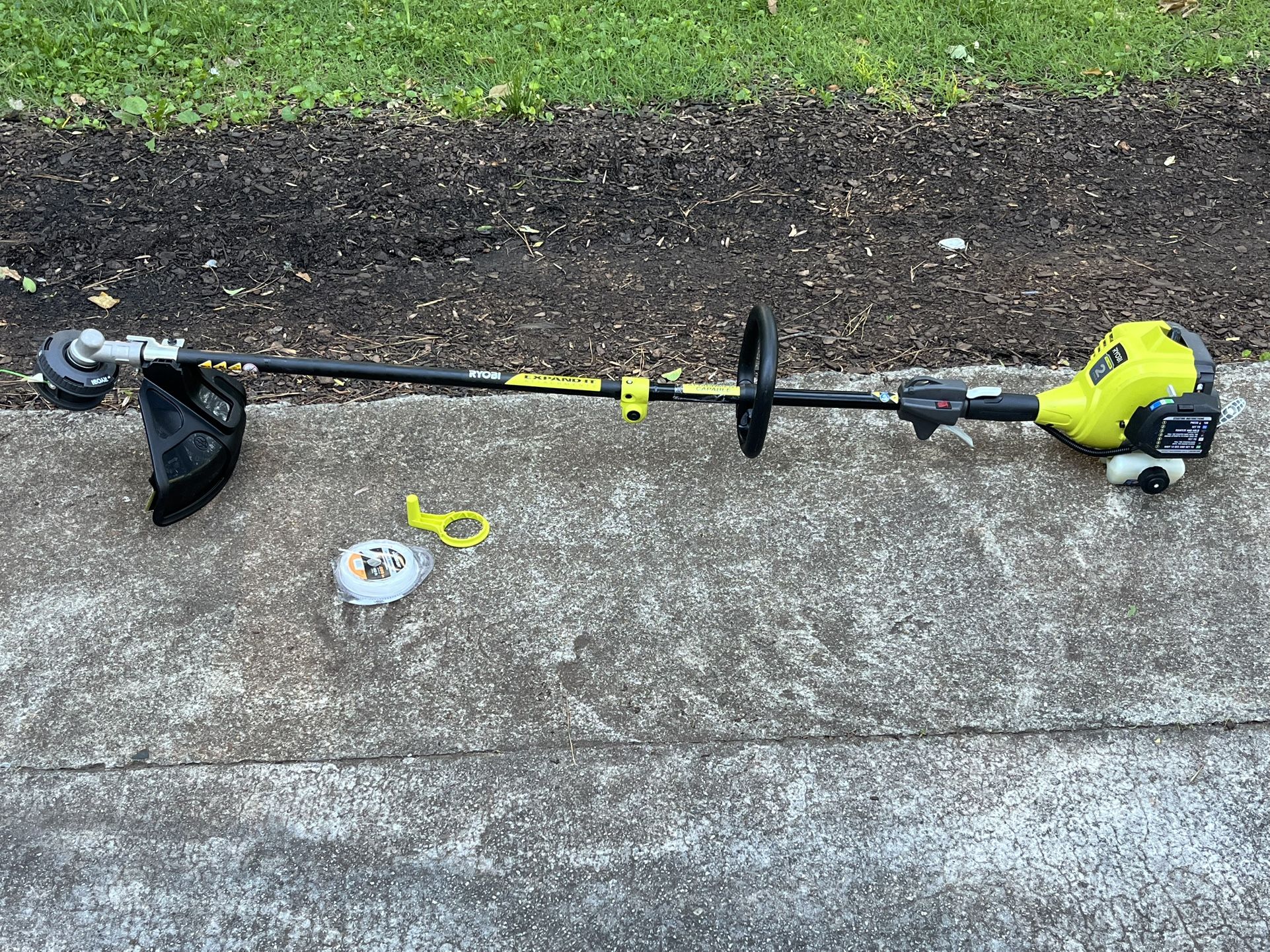 RYOBI 25 cc 2-Stroke Attachment Capable Full Crank Straight Gas Shaft String Trimmer used 60