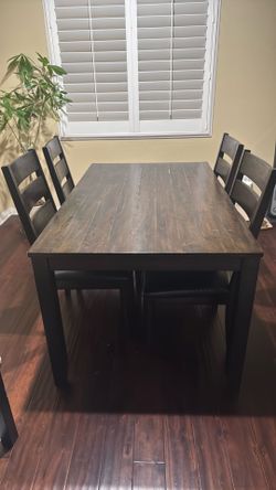 Wooden dining table and 4 chairs