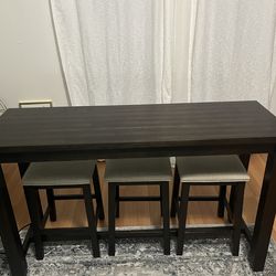Barstool table  with outlets  —-  and 4 matching barstool chairs —- W- 20” x  L-  5’ x  H - 36”. - Choc Brown -