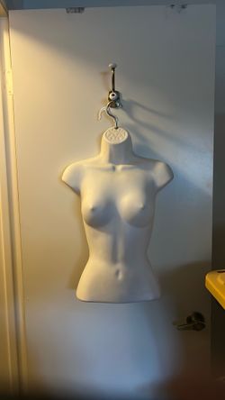 Female mannequin with hanger attached Female mannequin with hanger attached