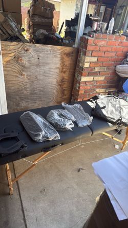 Folding massage table