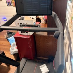 Peloton Treadmill, Punching Bag, And Equipment.