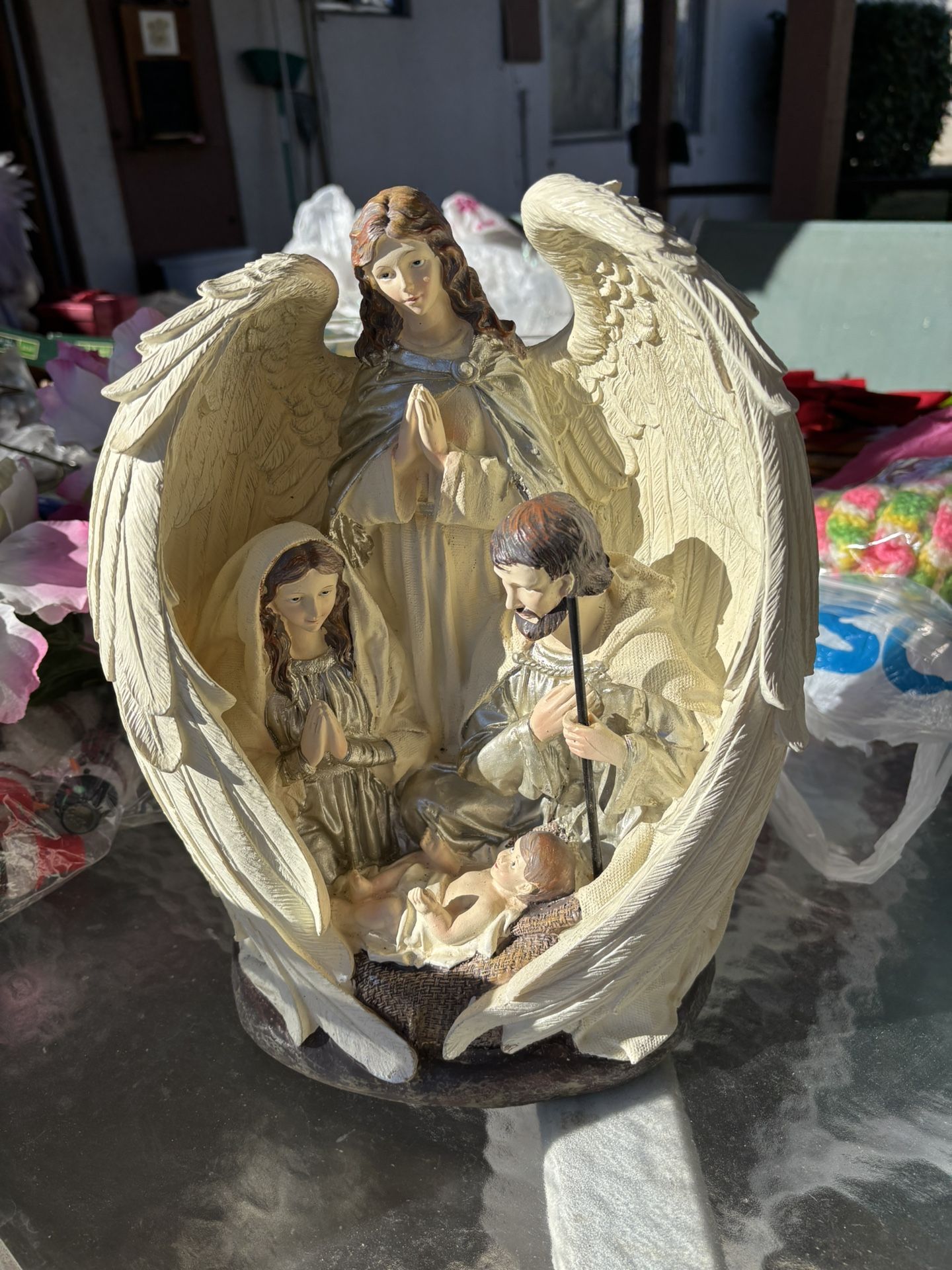 Angel With Mary, Joseph And Baby Jesus Statue