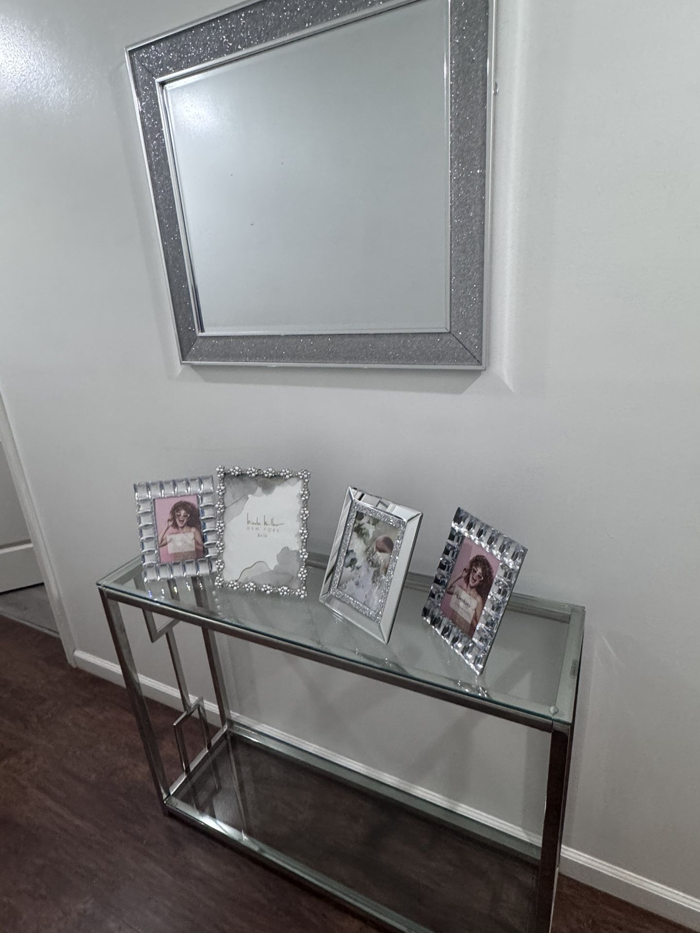 Glass Table With Pictures Frames and Mirror