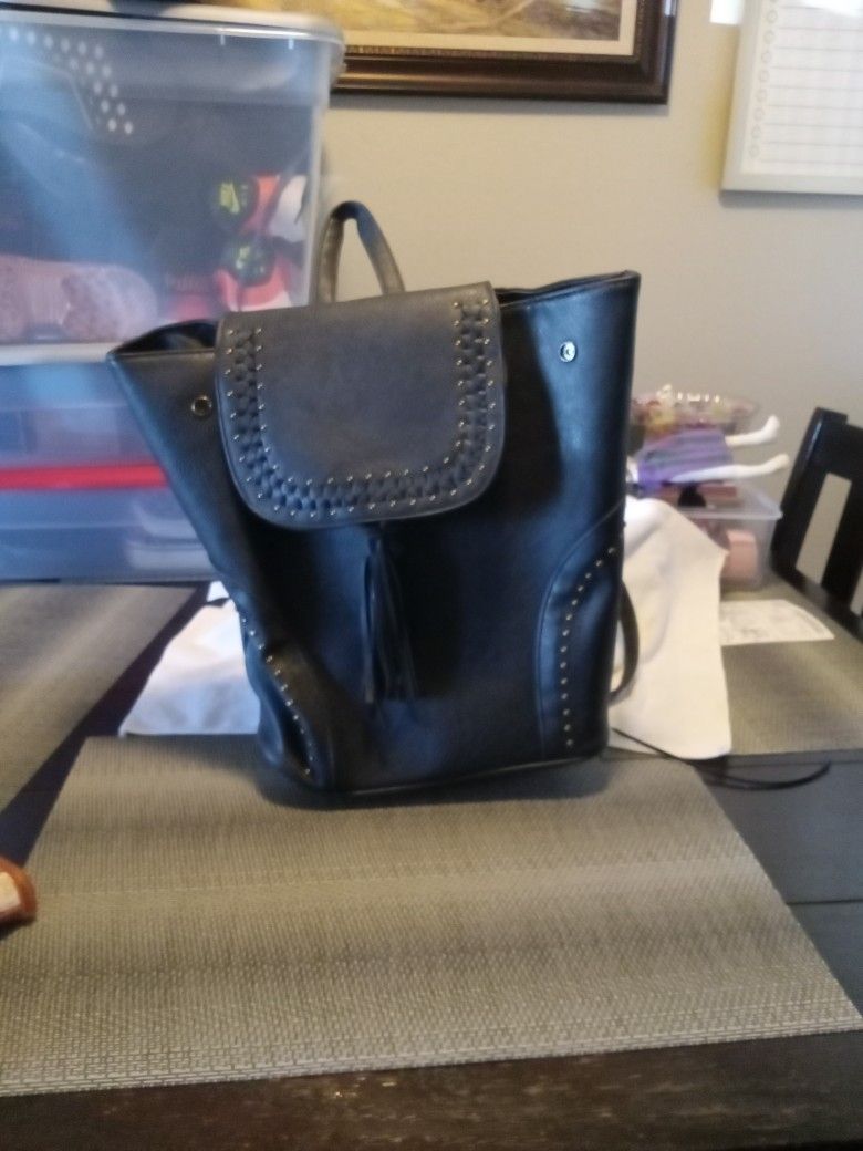 Black backpack purse.