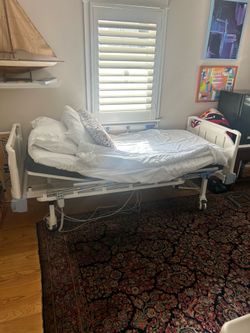 Hospital Bed Adjustable slightly used one year and no longer needed. White color, strong and sturdy  and comes with remote for ease of use and on whee