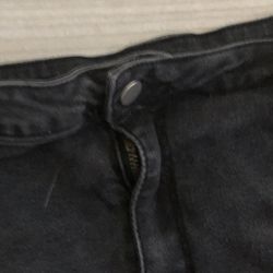 Black low rise shorts with a distressed look