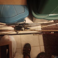 A Bunch Of Fishing Items Poles Reels Etc