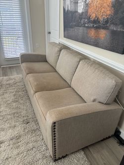 3-Cushion Tan Fabric Sofa / Couch – Nailhead Trim Detail