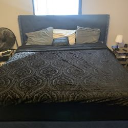 King upholstery tall headboard bed