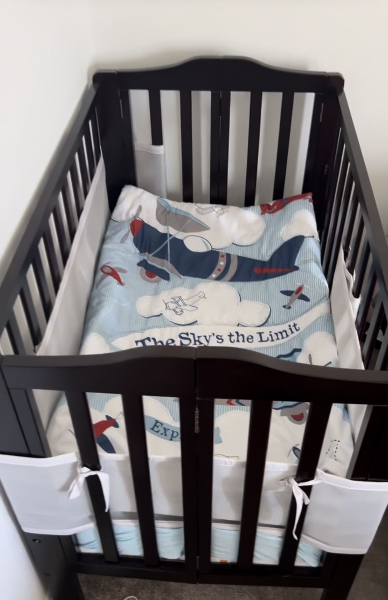 Delta Children Folding Portable Mini Baby Crib with 1.5-inch Mattress, Dark Chocolate