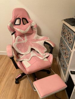 Pink gaming chair with pullout leg rest & 2 ribbon rugs
