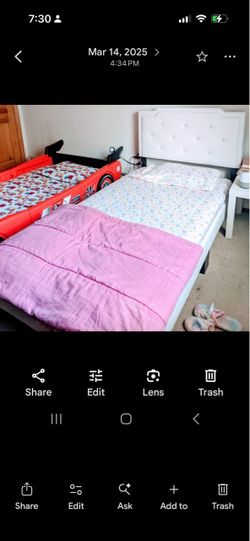 White Twin bed with mattress and white headboardh