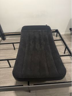 Black twin size blow up mattress with pump inside