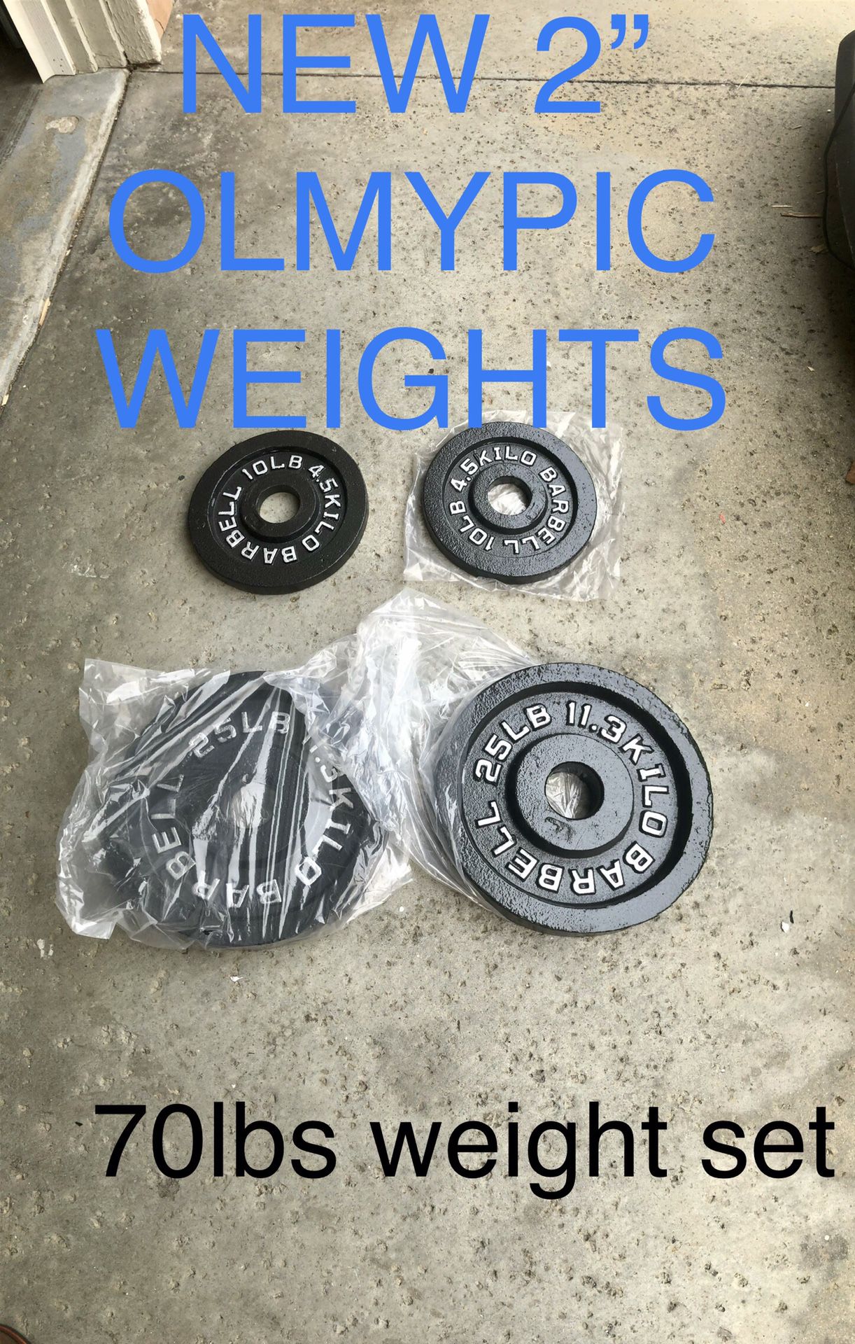 NEW Olympic weights 2” 25lbs and 10lbs pair iron plates home gym