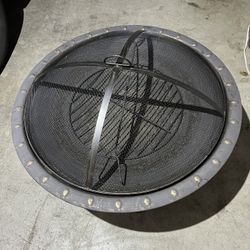 Hampton Bay Sadler 29.33 in. D 19.21 in. H Round Steel Wood Fire Pit in Bronze with Spark Screen and Poker  Located in concord  Never been used   $40 