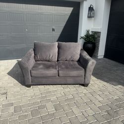 Dark grey loveseat