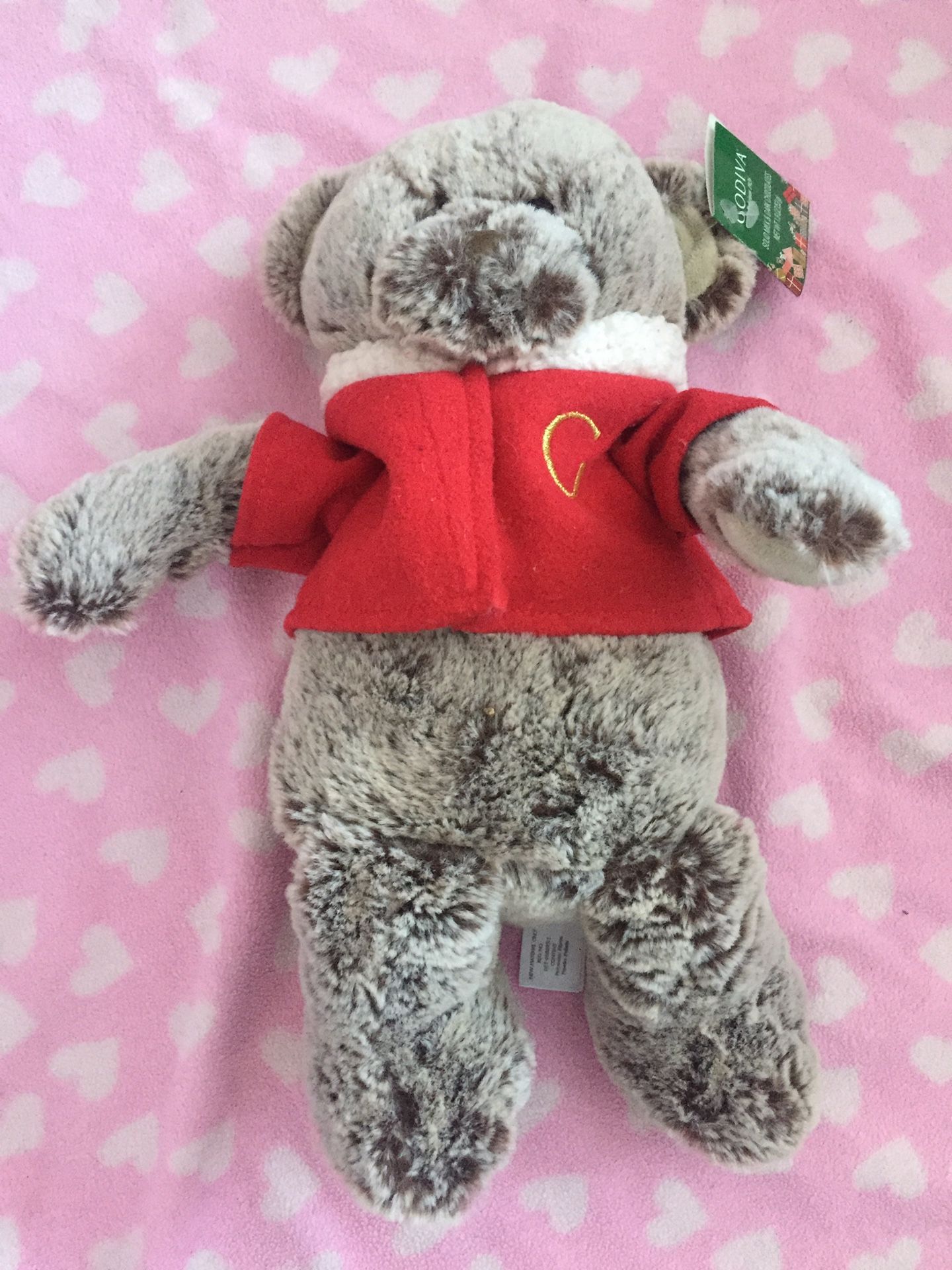 Godiva brown white teddy bear new with red jacket holiday edition.