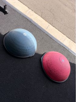 Two Bosu Balls, one blue, one pink