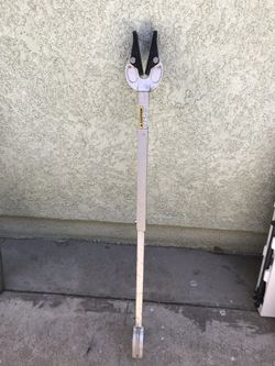 Boat motor support arm