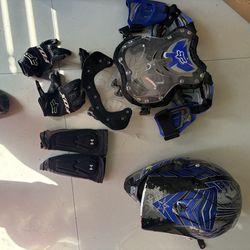 Blue fulmer kids dirtbike helmet with arm pads gloves and a chest protector