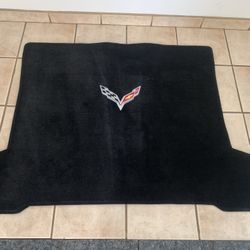 black car floor mat with a logo on it