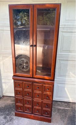 Vintage BOMBAY Company Wood Tall Apothecary-Style Storage cabinet.