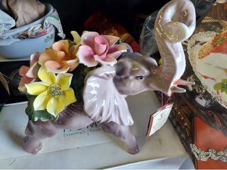 Ceramic Elephant Figurine with Floral Arrangement