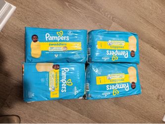 Four packs of SIZE 1 pampers