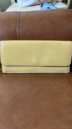 Coach Slim Envelope Trifold Wallet styled in light vanilla or buttercup yellow leather