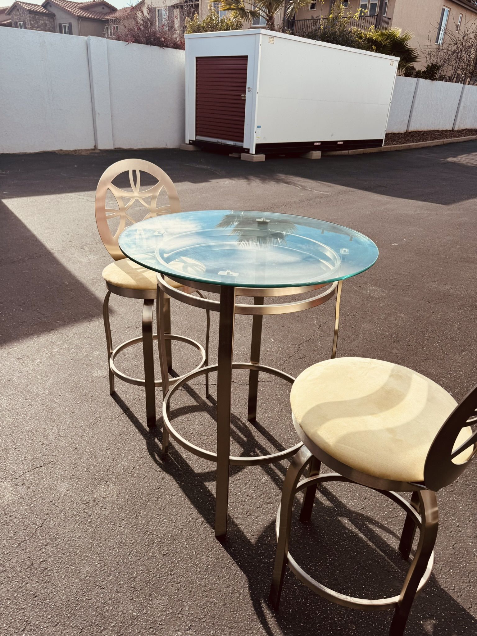 Beautiful set of Modern Swivel Stool with Round Back – in Brushed Steel 2 hight chairs & glass tab