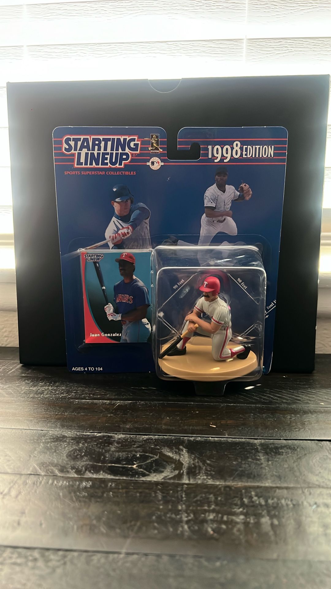 The item is a 1998 Starting Lineup sports collectible featuring Juan Gonzalez of the Texas Rangers. Key details include: