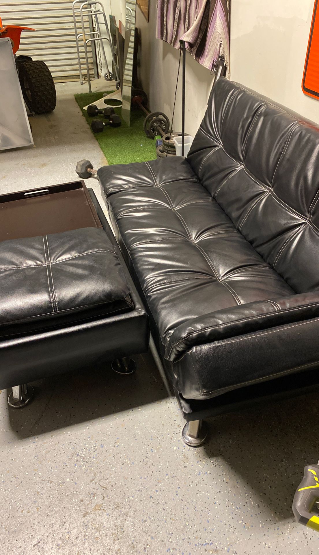 Black leather futon with table autumin great shape 200 . 00
