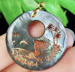 Carved abalone shell pendant