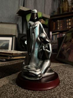 Praying Metallic Statue