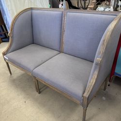 Pair Of Grey fabric settees with a distressed wood frame