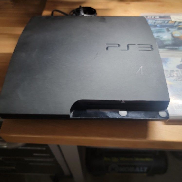 PS3 NOT WORKING, does Not turn on. Games, Rock Band And Controllers Included