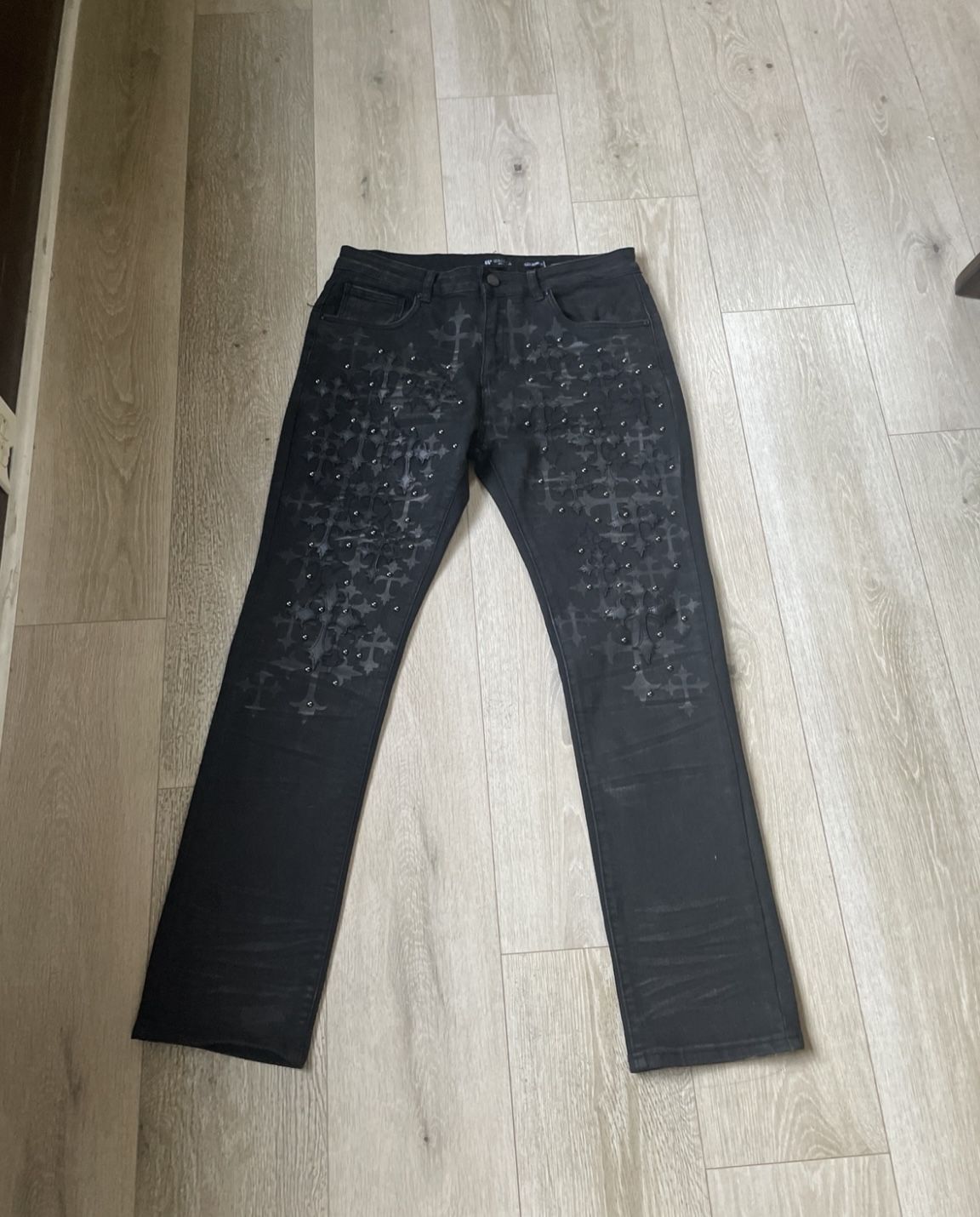 Premium black designer denim jeans with custom detailing