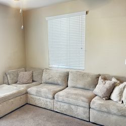 Cream Modular sectional sofa with ottoman