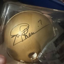 Autographed Notre Dame mini football helmet signed by Joe Theismann with number 7