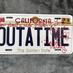 BACK TO THE FUTURE AUTOGRAPHED LICENSE PLATE BY CLAUDIA WELLS