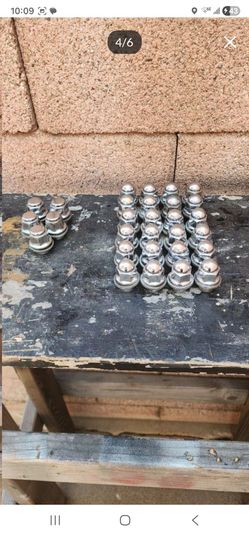 85 Nissan 720 St rims lug nut set.