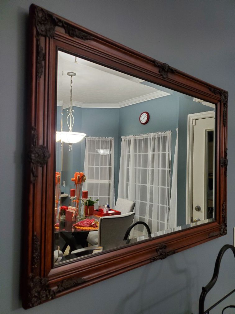 Dark stained wooden mirror