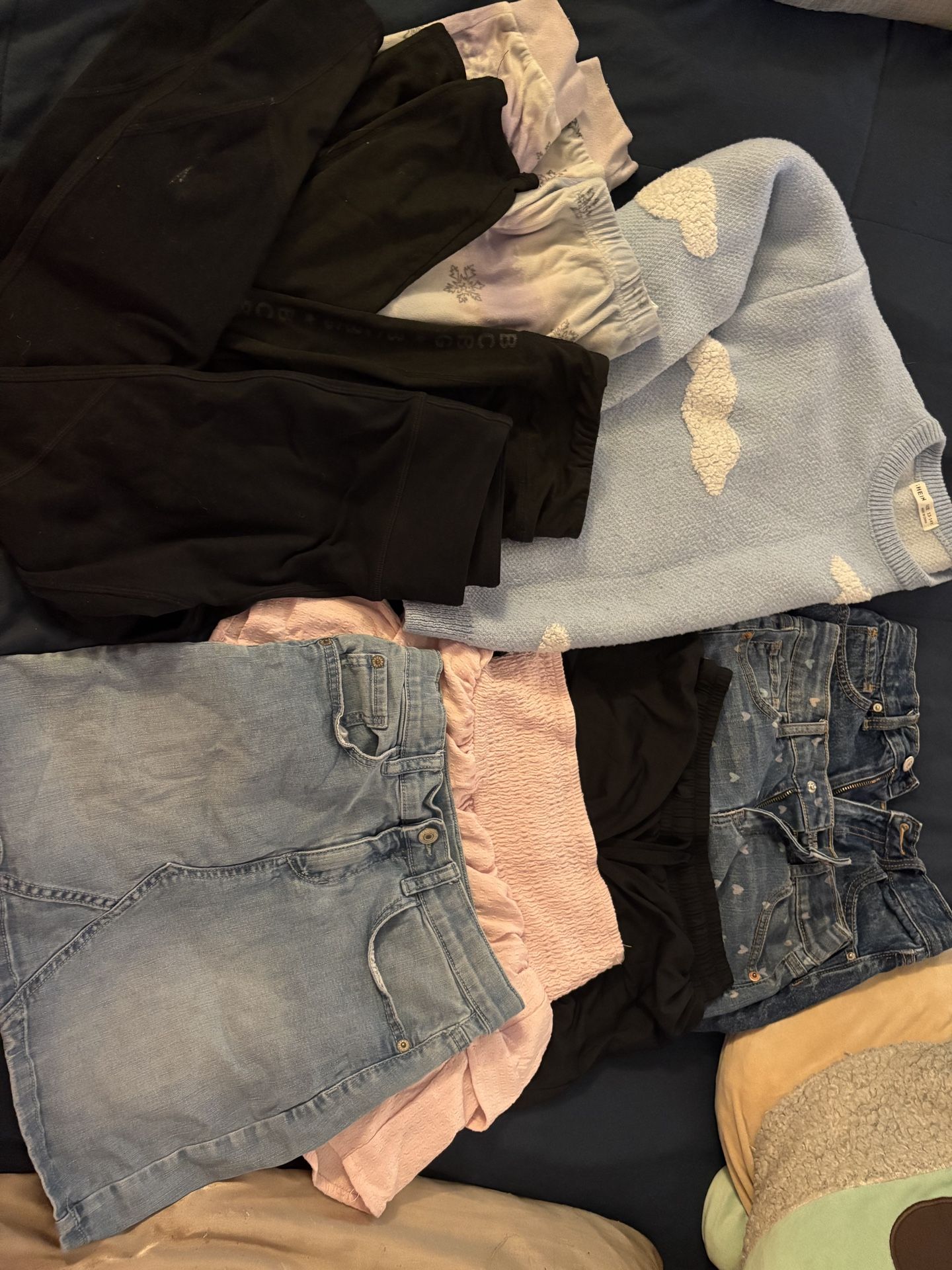 10-12 3 pairs of shorts, 2 skirts, 2 pairs of leggings 1 pj bottom and sweatshirt (used)
