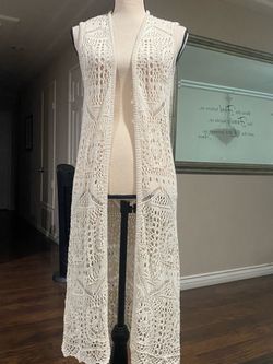 Women’s long crochet knit cardigan.
