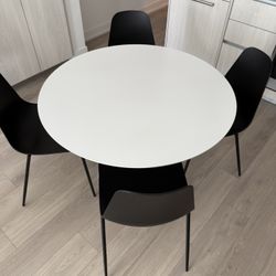 Round White Dining Table & 4 Black Chairs