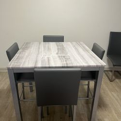 Marble Table And 4 Grey Chairs
